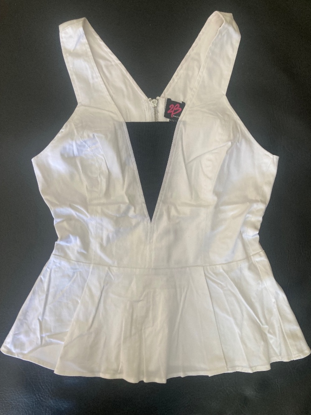 NWT Bebe 2b white black cutout mesh peplum top